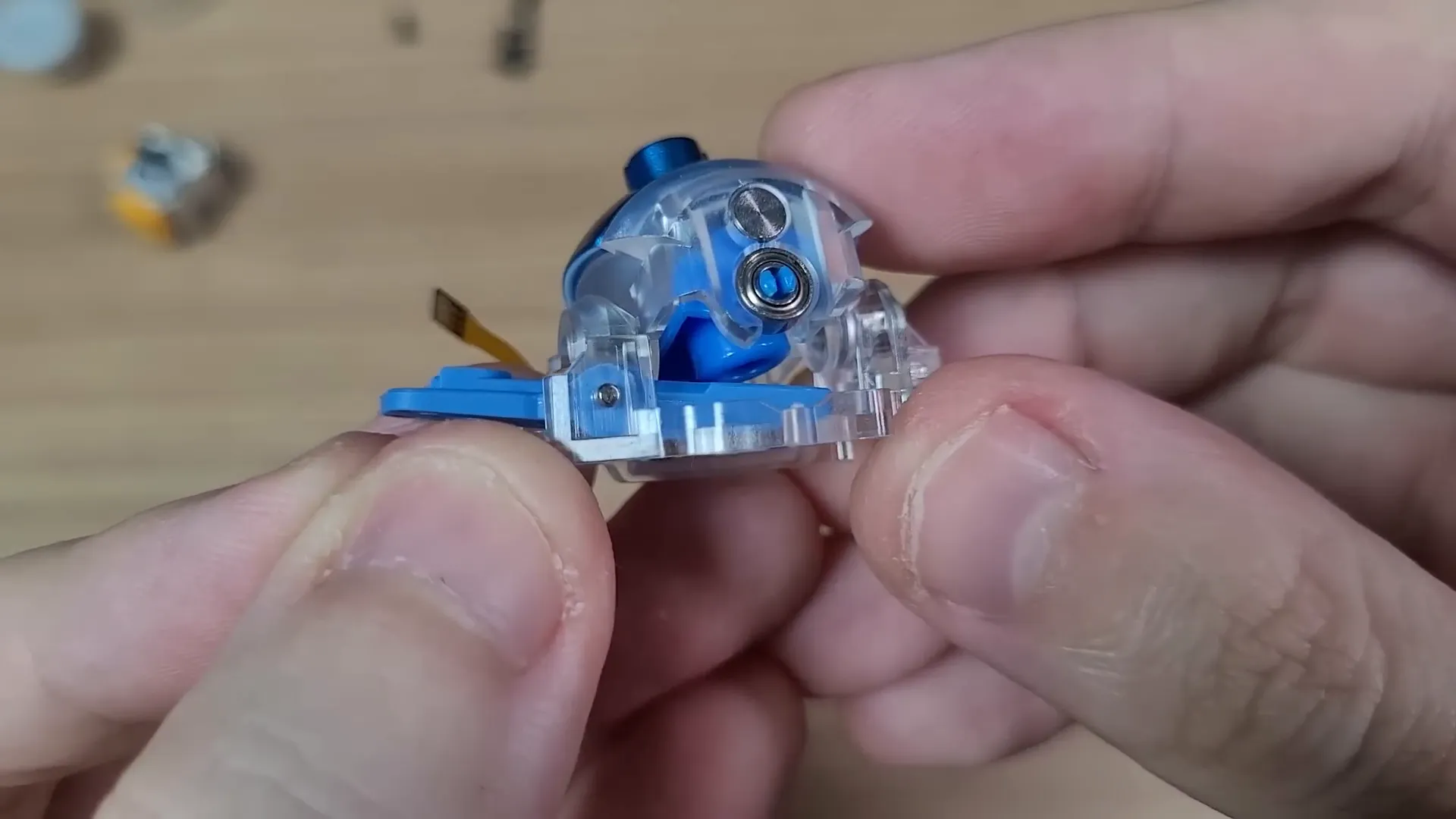 Flydigi Apex 4 seesaw analog stick mechanism with magnets and sensors
