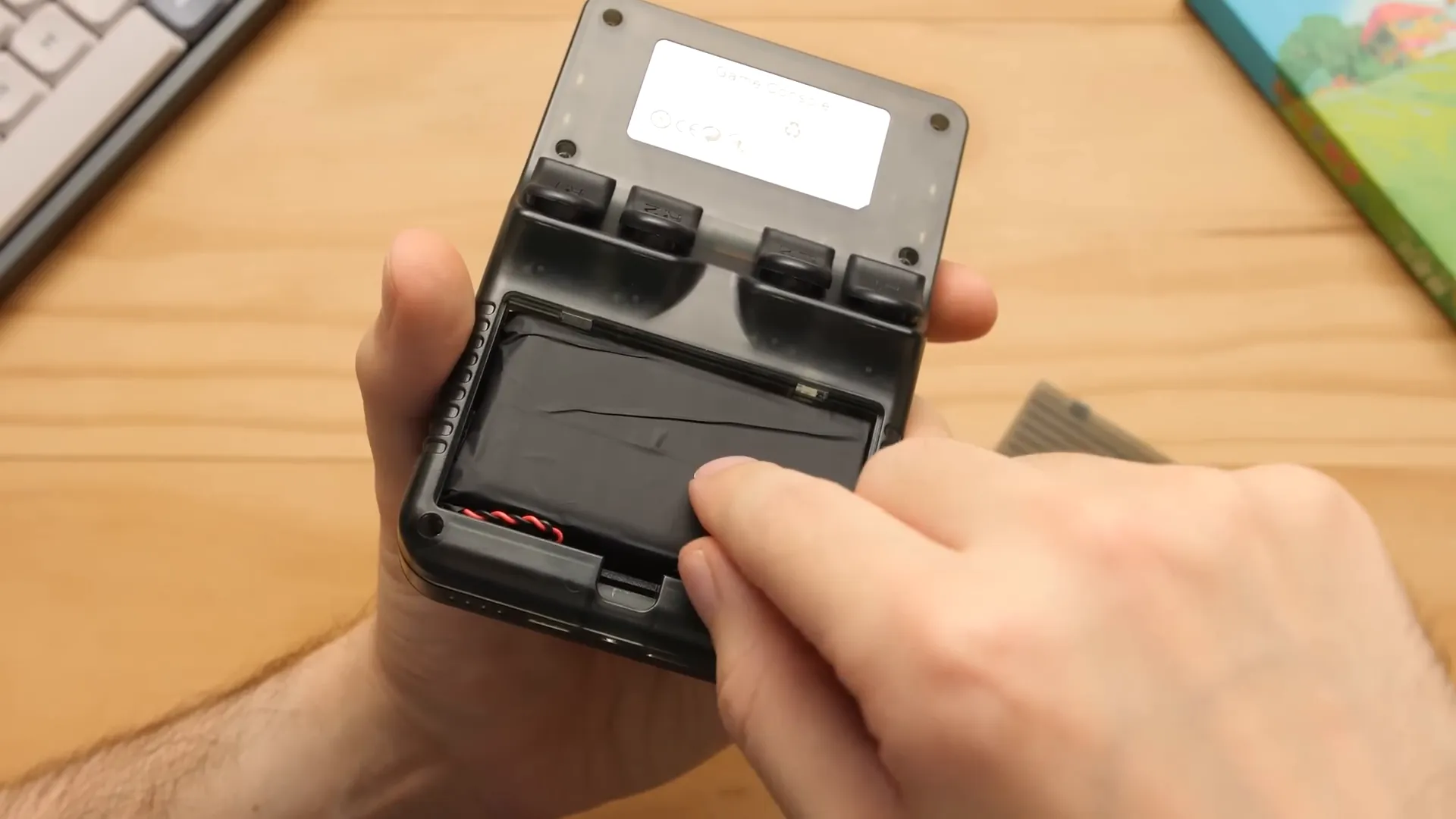 Back of R36S showing removable battery compartment