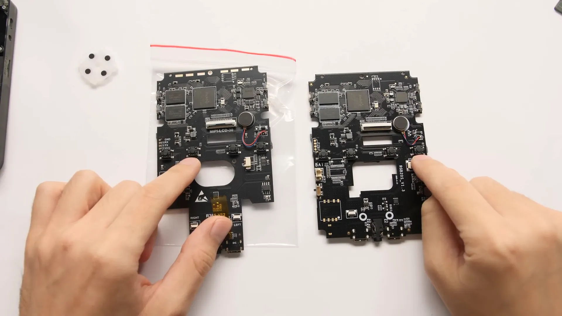 Side-by-side comparison of shoulder buttons on R36S and RGB 20S