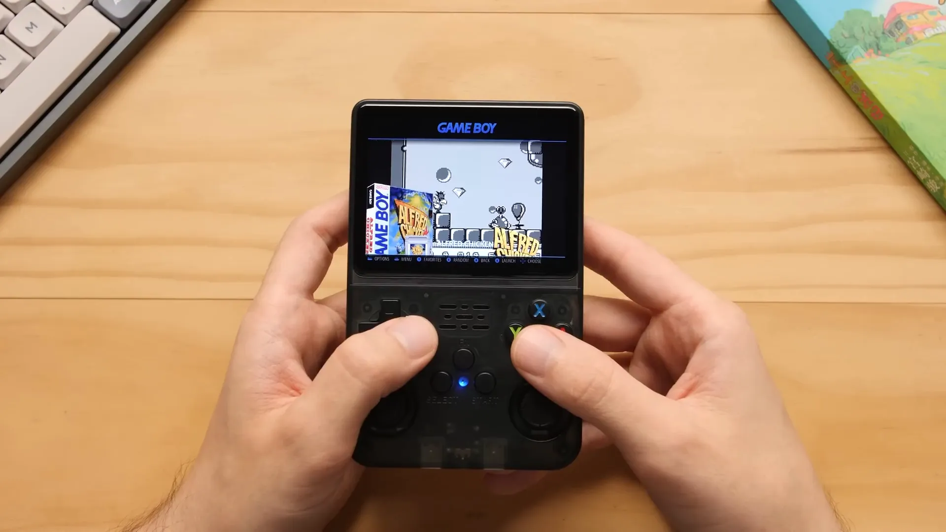 Aros OS game selection screen on R36S showing Game Boy games with box art