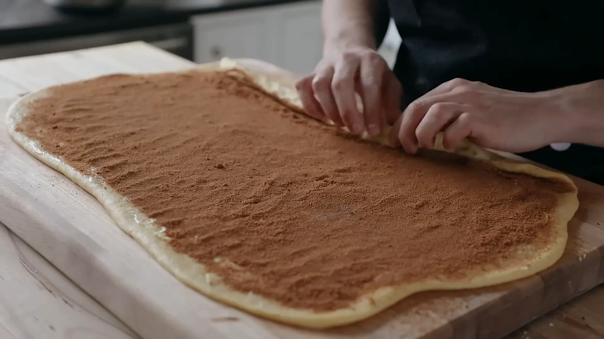 Rolling the dough into a log.