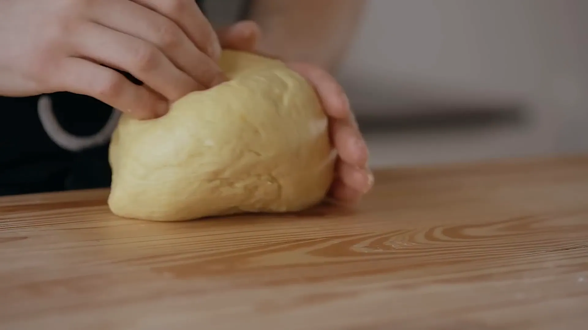 Forming dough into a ball.