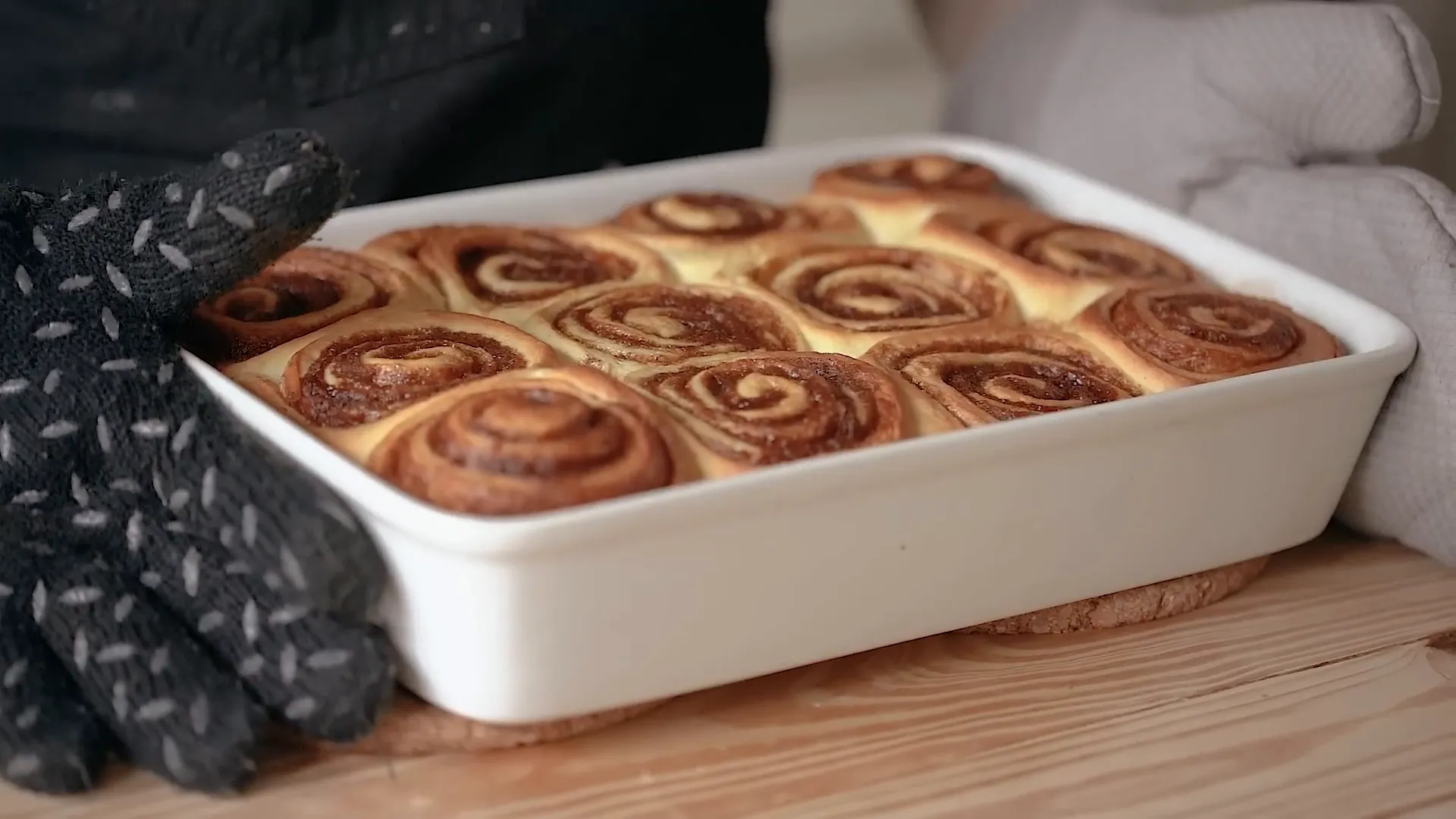 Cooling the cinnamon rolls after baking.