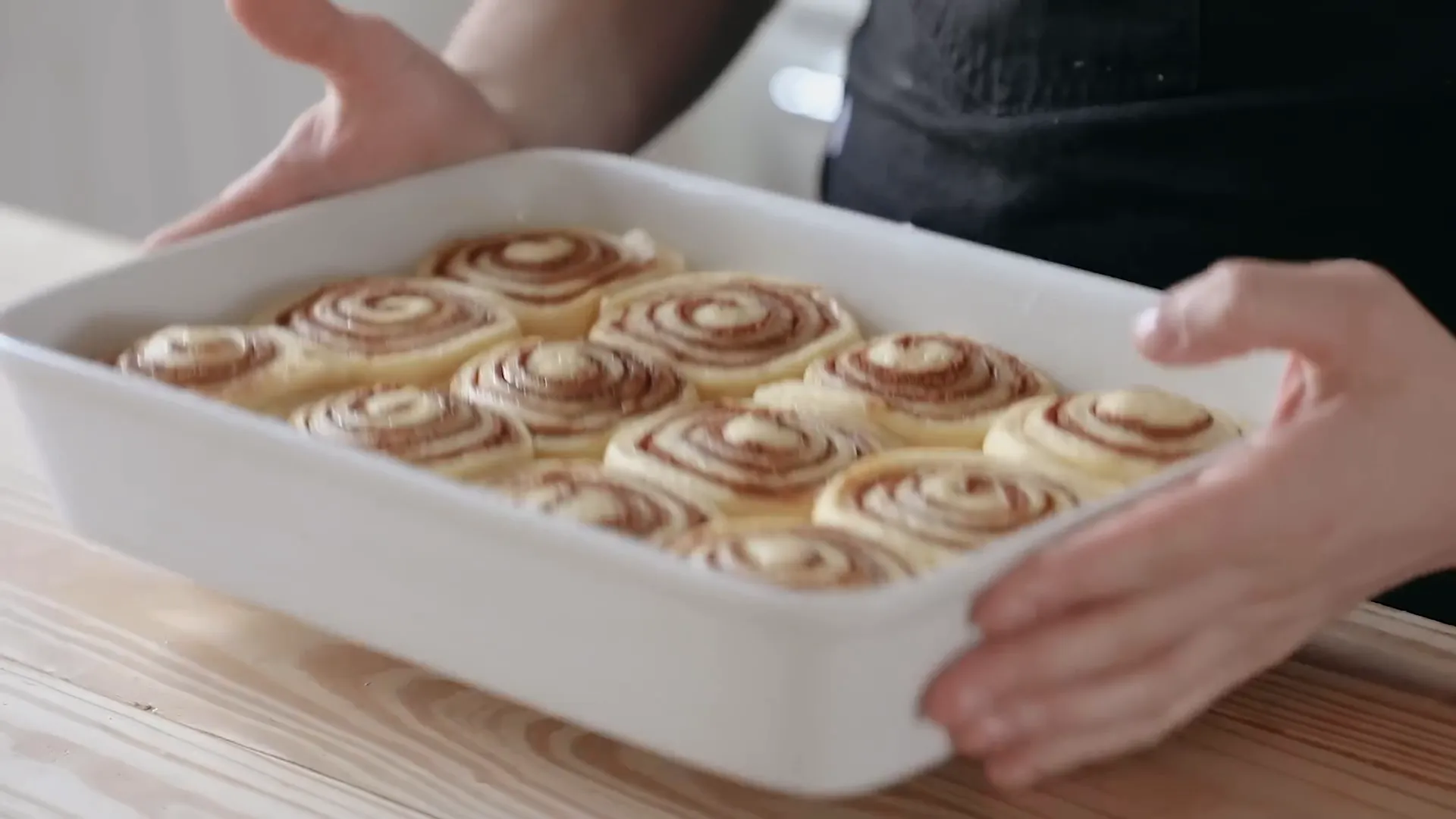 Baking the cinnamon rolls in the oven.