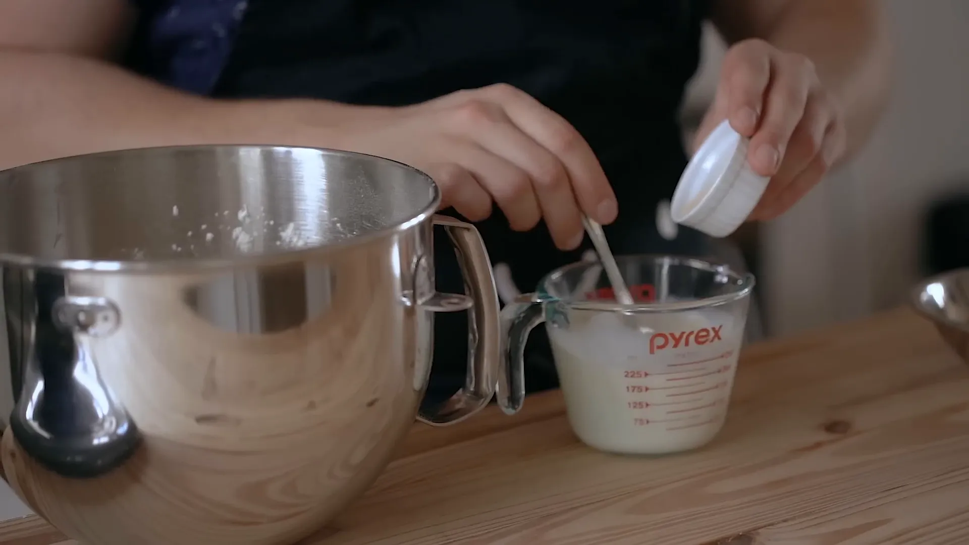 Dissolving yeast in lukewarm milk.