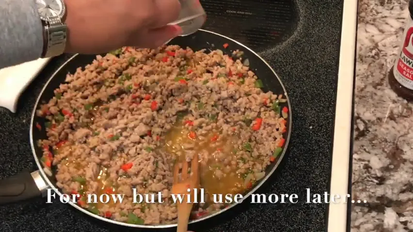 Adding chicken broth to the skillet