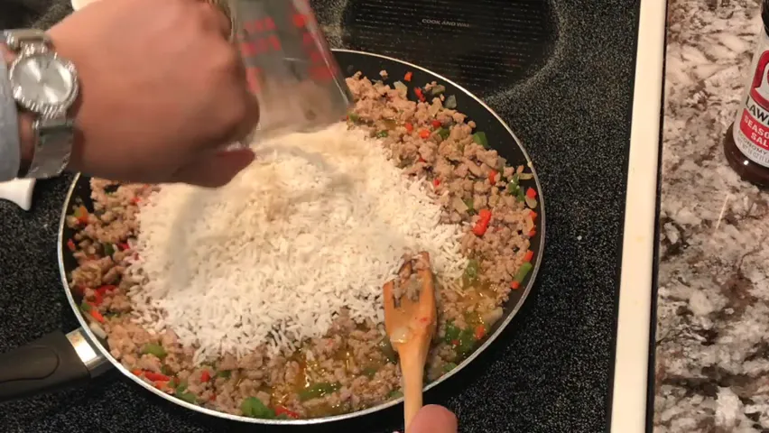 Adding rice to the mixture