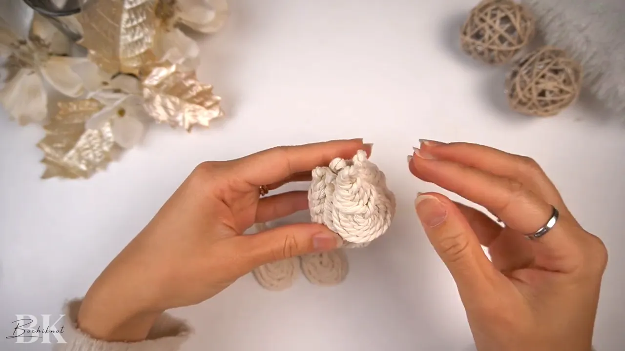 Front view of attached macrame Pipa knots showing the start of the tree shape