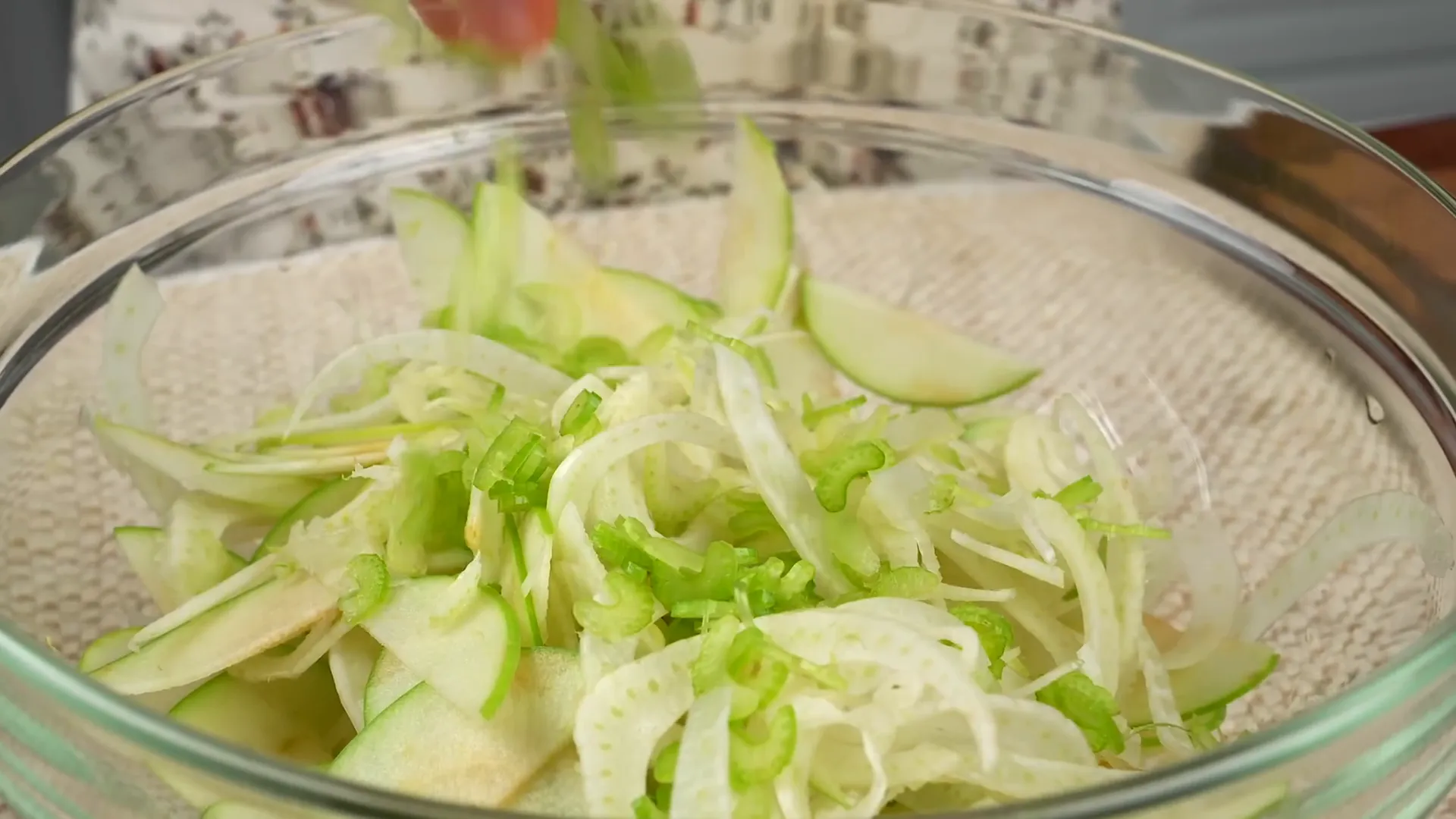 Mixing fennel, green apple, and celery for salad