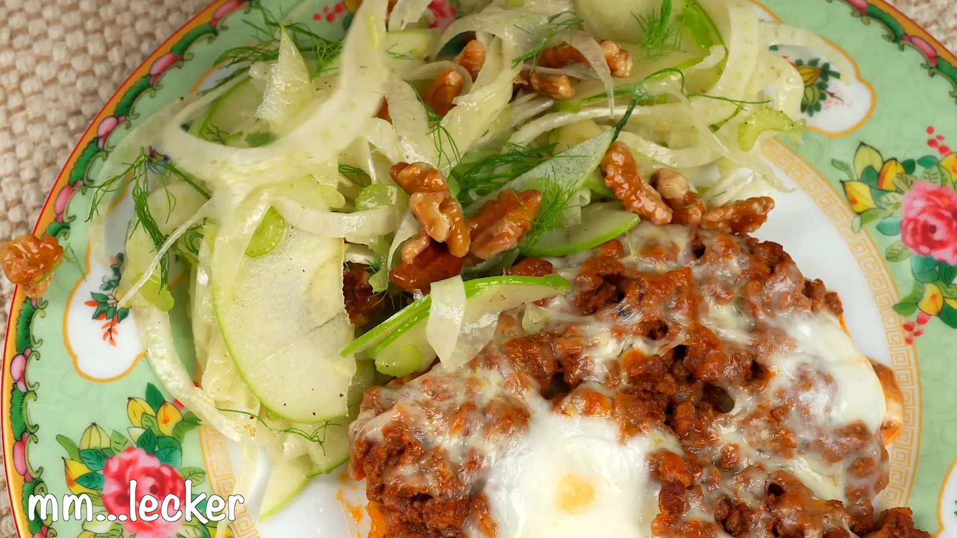 Final plated dish of ground beef and potato bake with salad