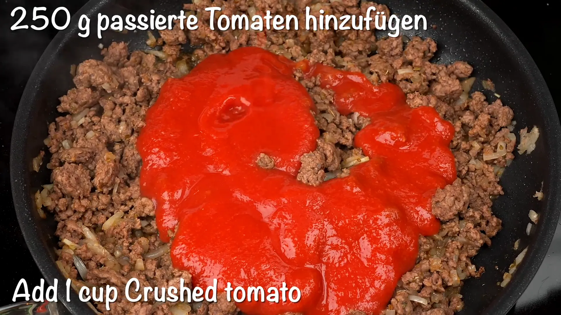 Adding tomato passata to the ground beef