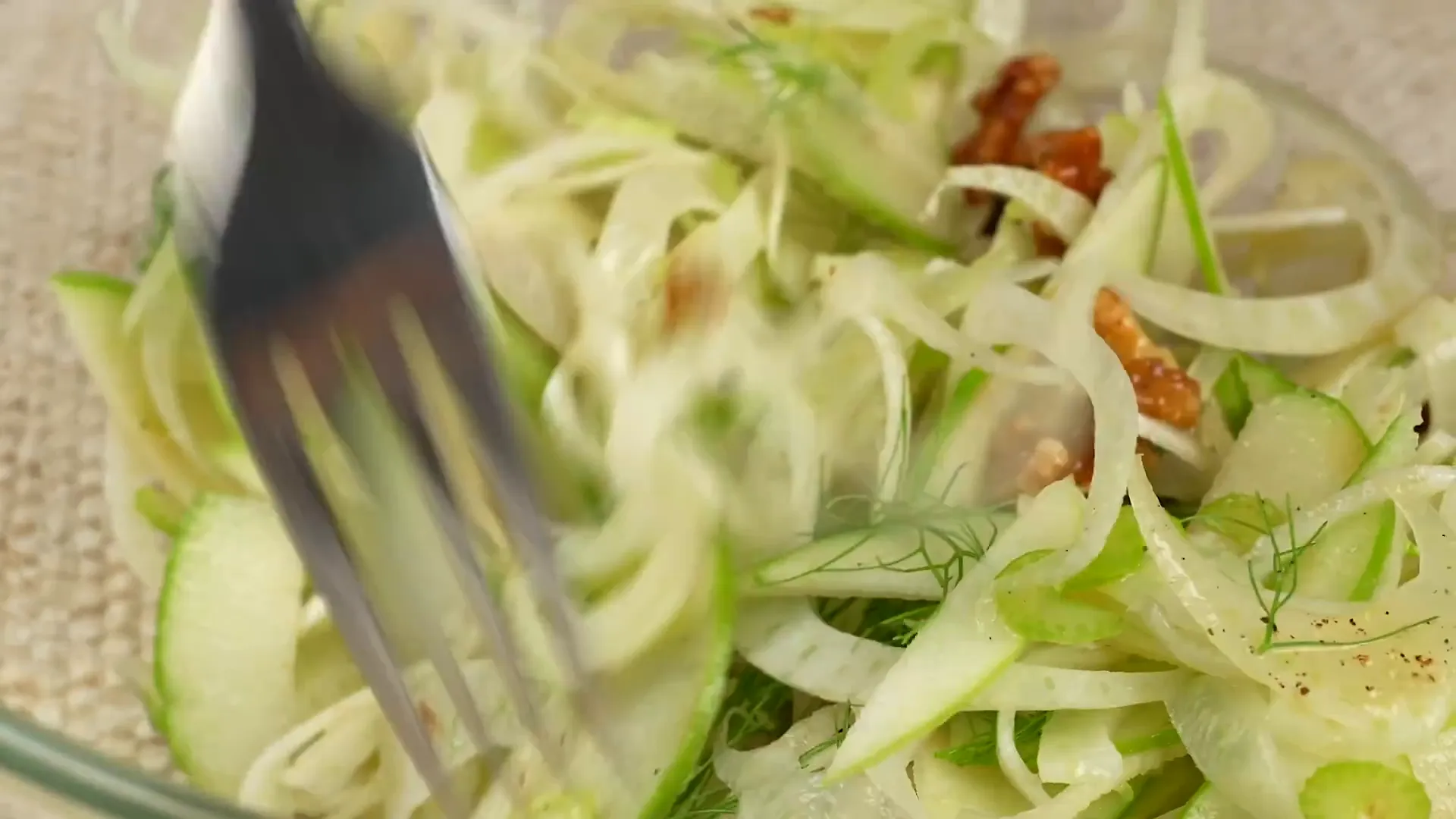 Tossing dressing with fennel salad