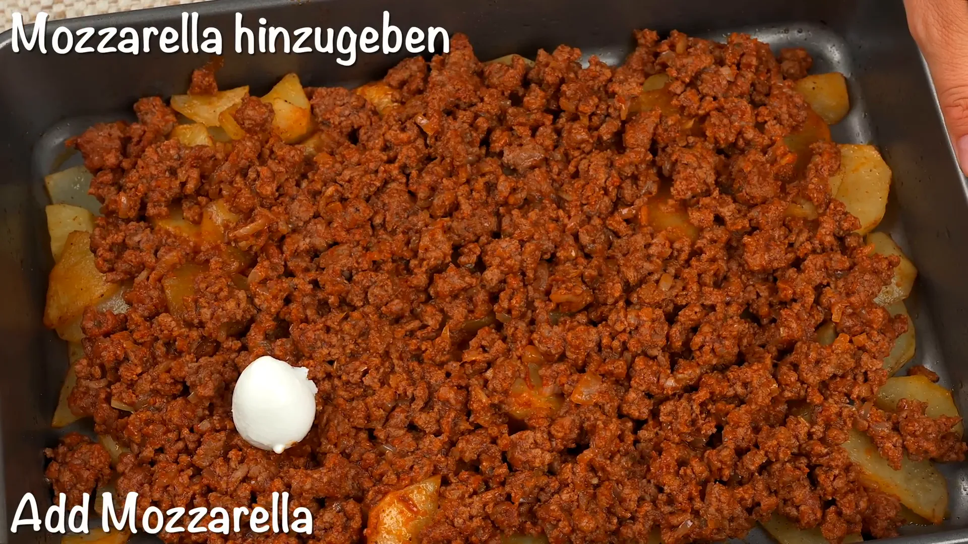 Adding mozzarella cheese over ground beef