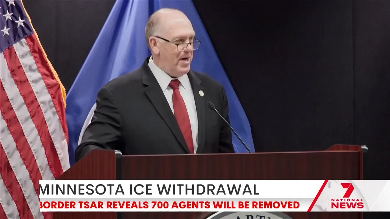 Federal official speaking at a podium with a clear chyron reading 'MINNESOTA ICE WITHDRAWAL' visible at the bottom.