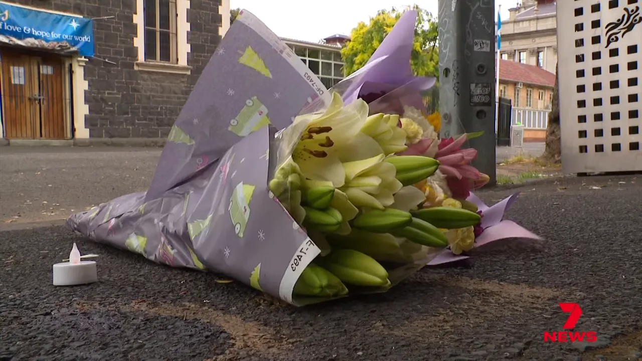 Bouquet of flowers lying on the footpath outside All Saints Church near the Fitzroy shooting location