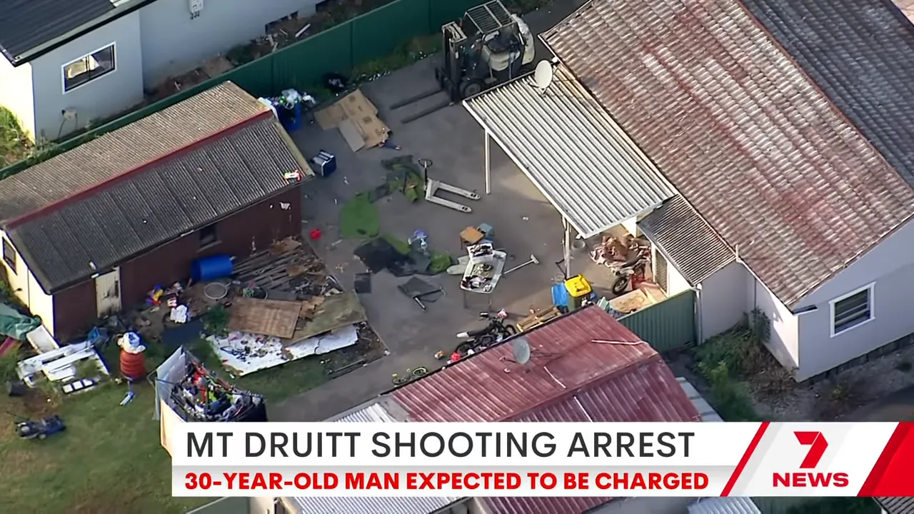 Aerial PolAir-style shot showing the backyard and buildings of the Mount Druitt property targeted in the shooting.