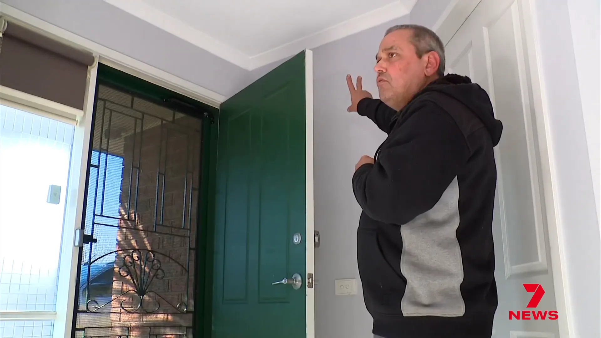 Les Toth confronting intruders outside bedroom door
