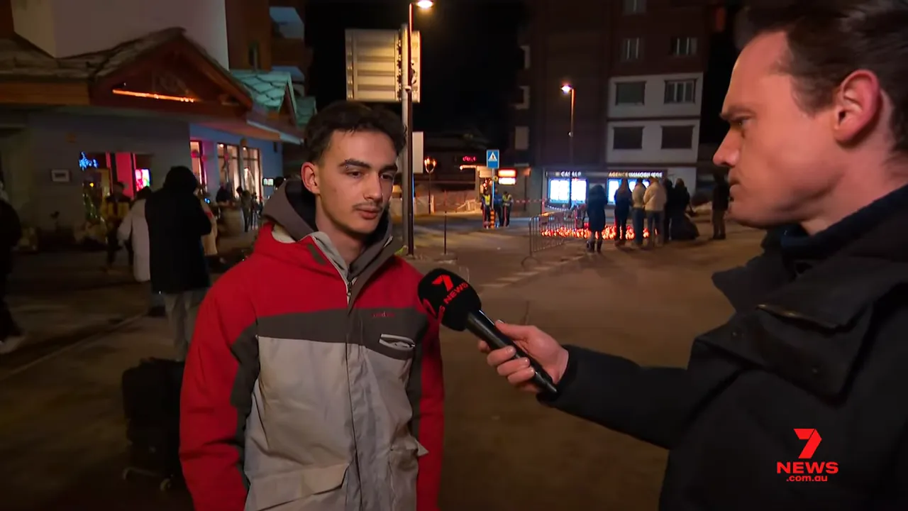 Eyewitness interview showing the witness, reporter's microphone and the cordoned-off area with people and candles behind them
