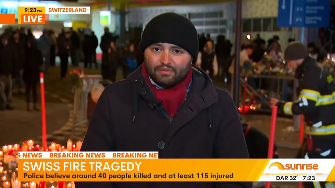 On-scene television reporter with candle memorial and emergency workers visible behind him in Crans-Montana.