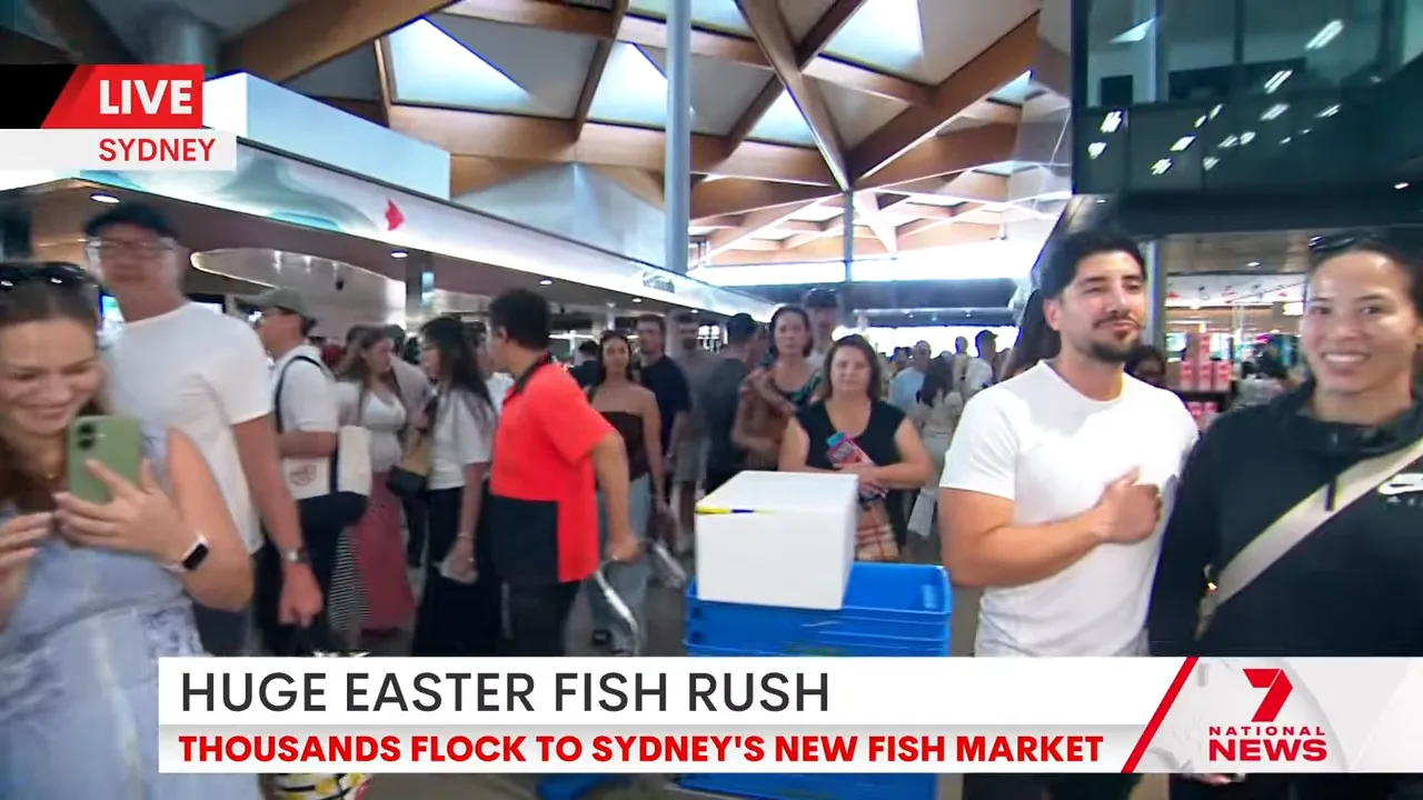 People walking through Sydney Fish Market concourse during Easter trading