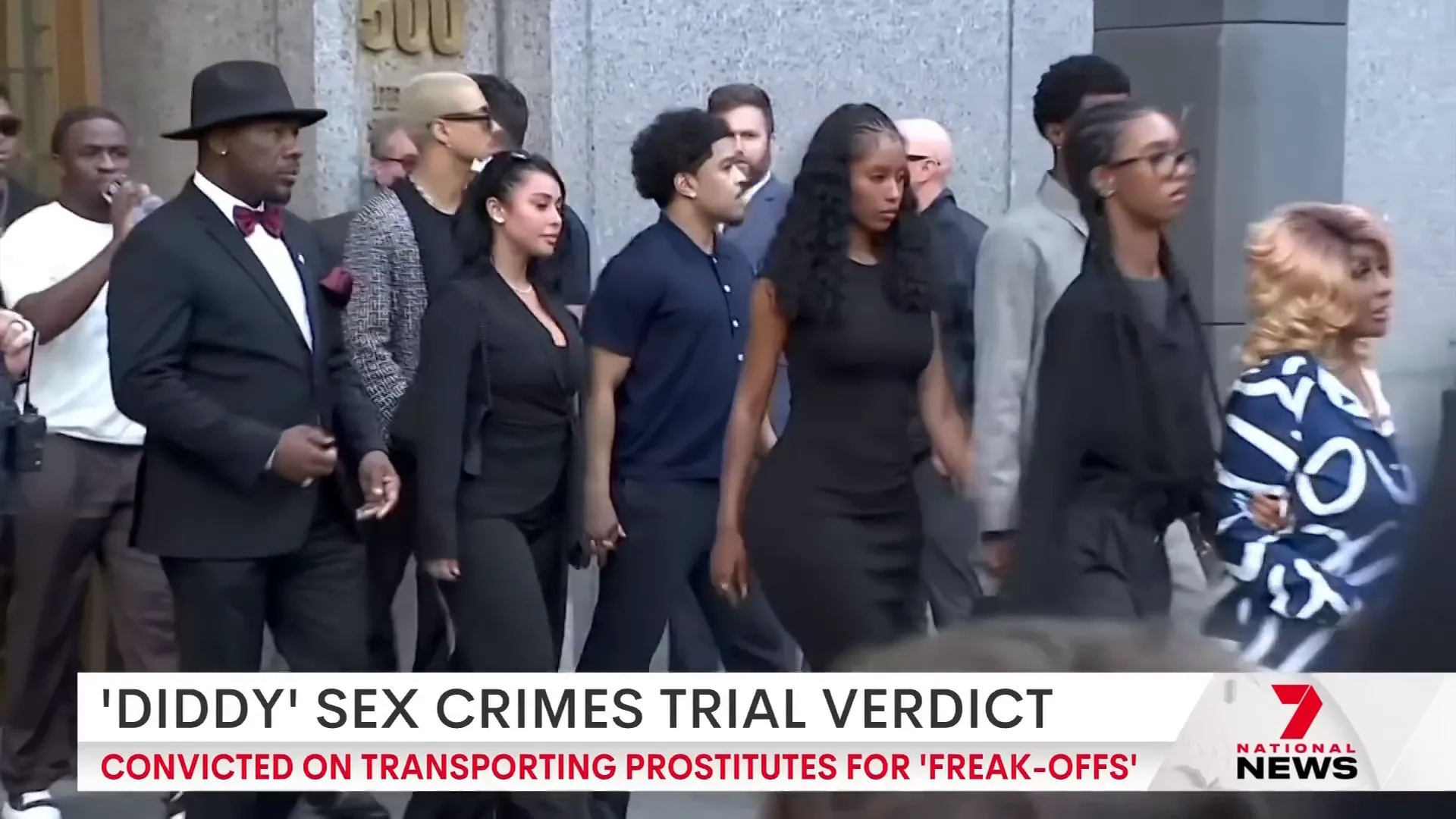 Courtroom scene with supporters and family