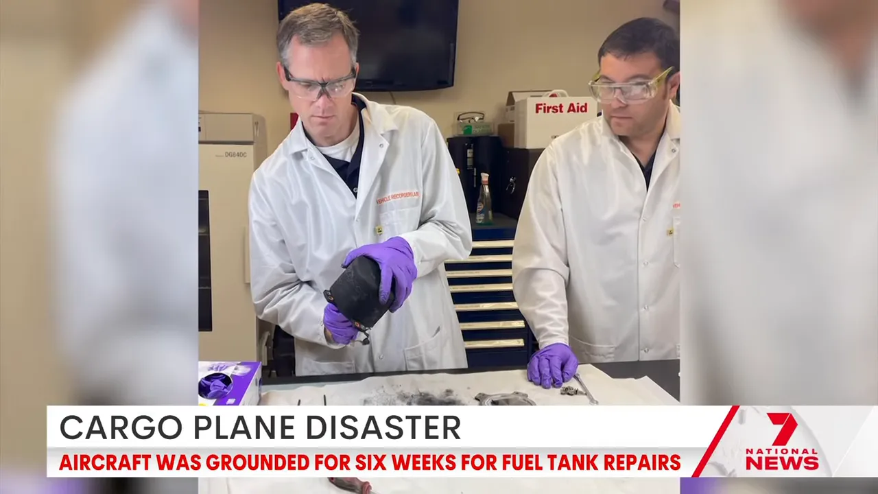 Recovered black box evidence being handled by investigators