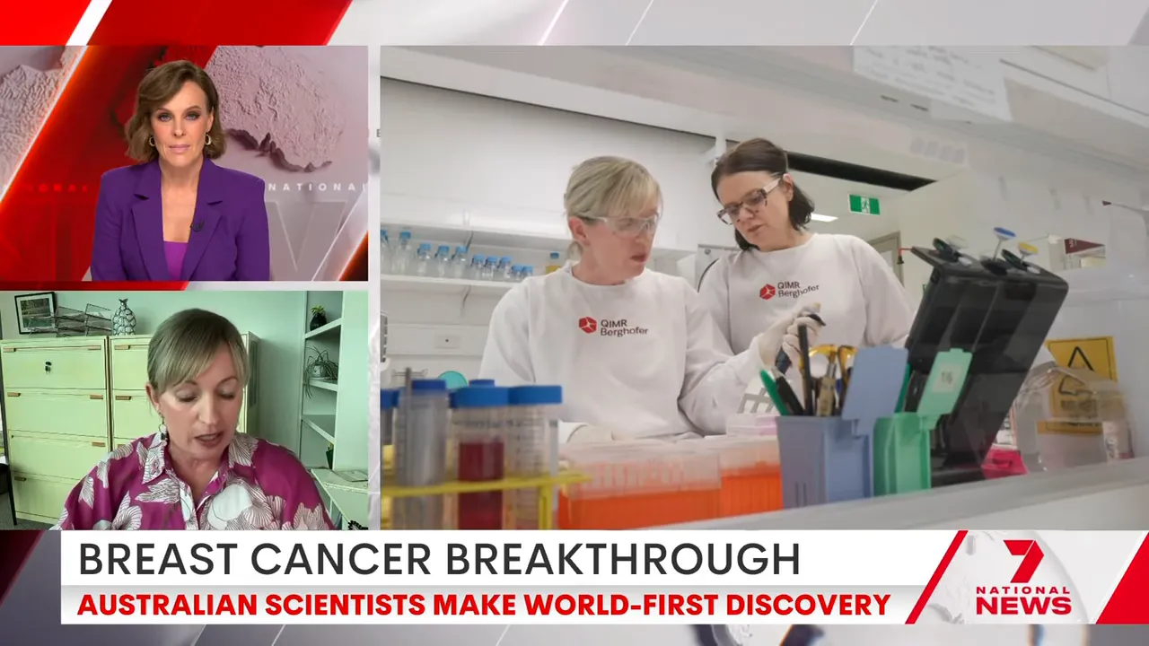 Two scientists in lab coats and protective eyewear working together at a laboratory bench with sample tubes and pipettes