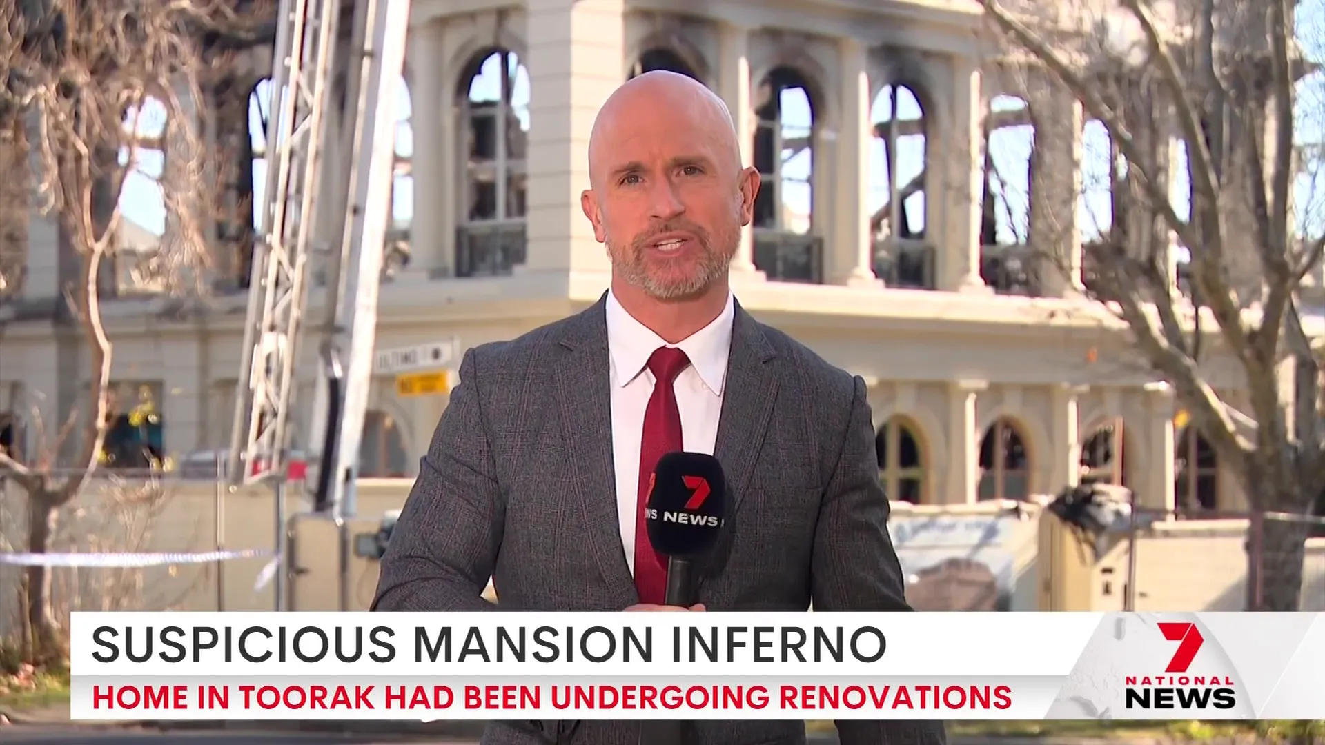 Police and detectives investigating the fire scene