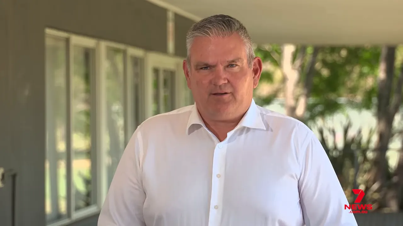 Well-framed image of a project spokesperson in a white shirt giving an outdoor media statement