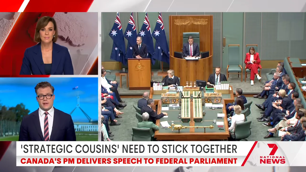 Speaker at the parliamentary podium with Australian flags and chamber seating