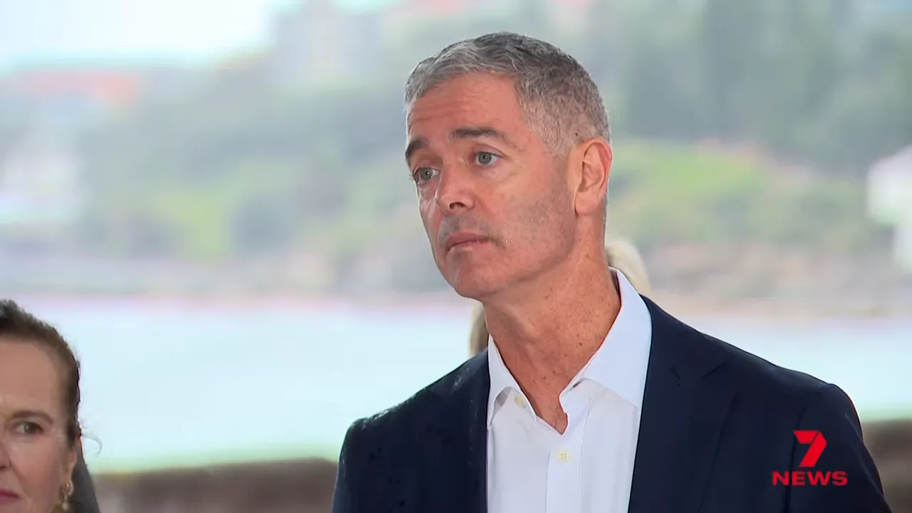 Clear portrait of the transport minister speaking at an outdoor news conference