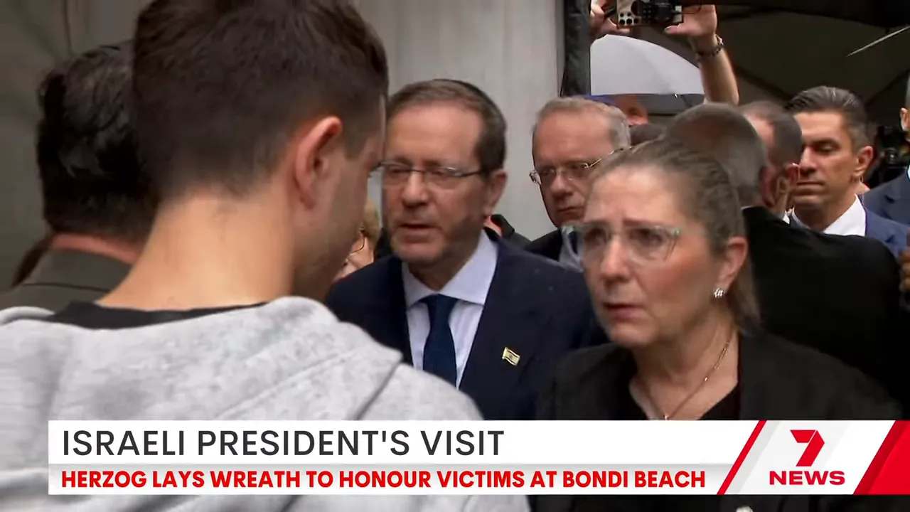 President Isaac Herzog speaking to reporters and members of the public at the Bondi memorial