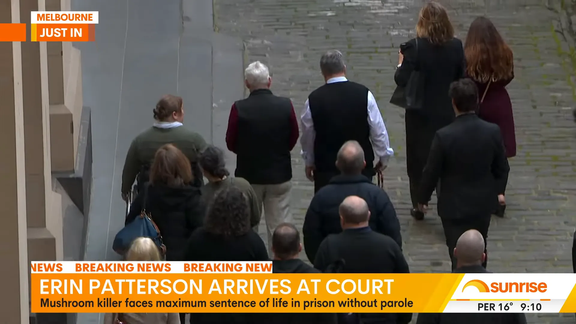 Erin Patterson being led from the prison van towards the court