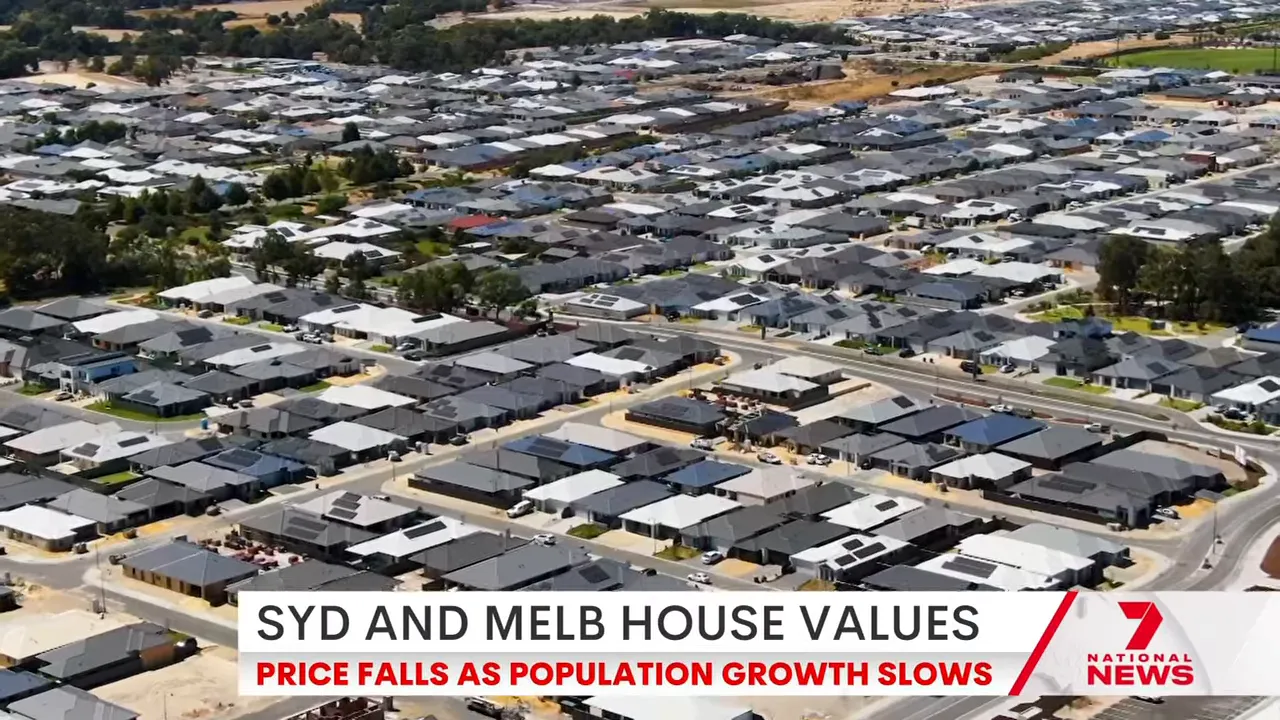 Drone aerial of housing estate for Sydney and Melbourne house values with “Price falls as population growth slows” banner