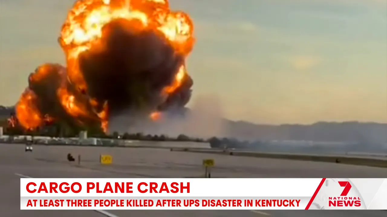 Video frame showing the left wing of the MD-11 on fire before a large explosion