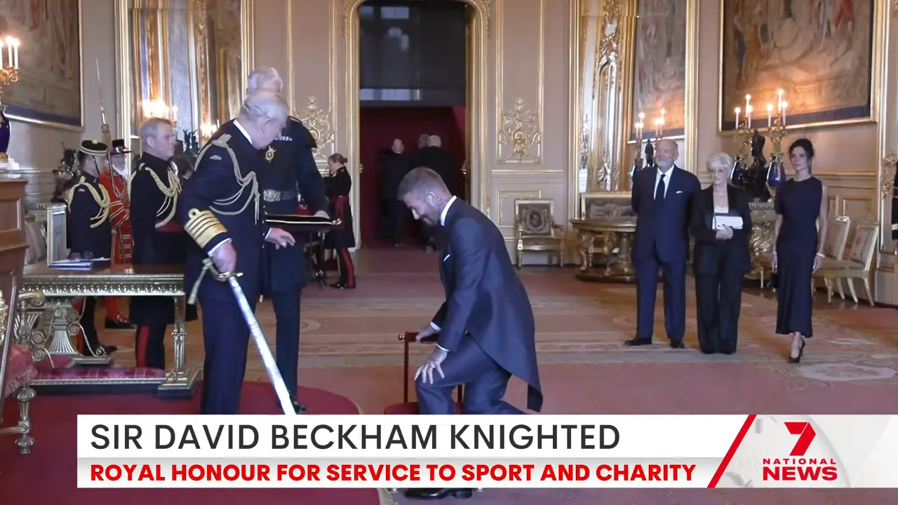 David Beckham kneeling before King Charles during knighting ceremony