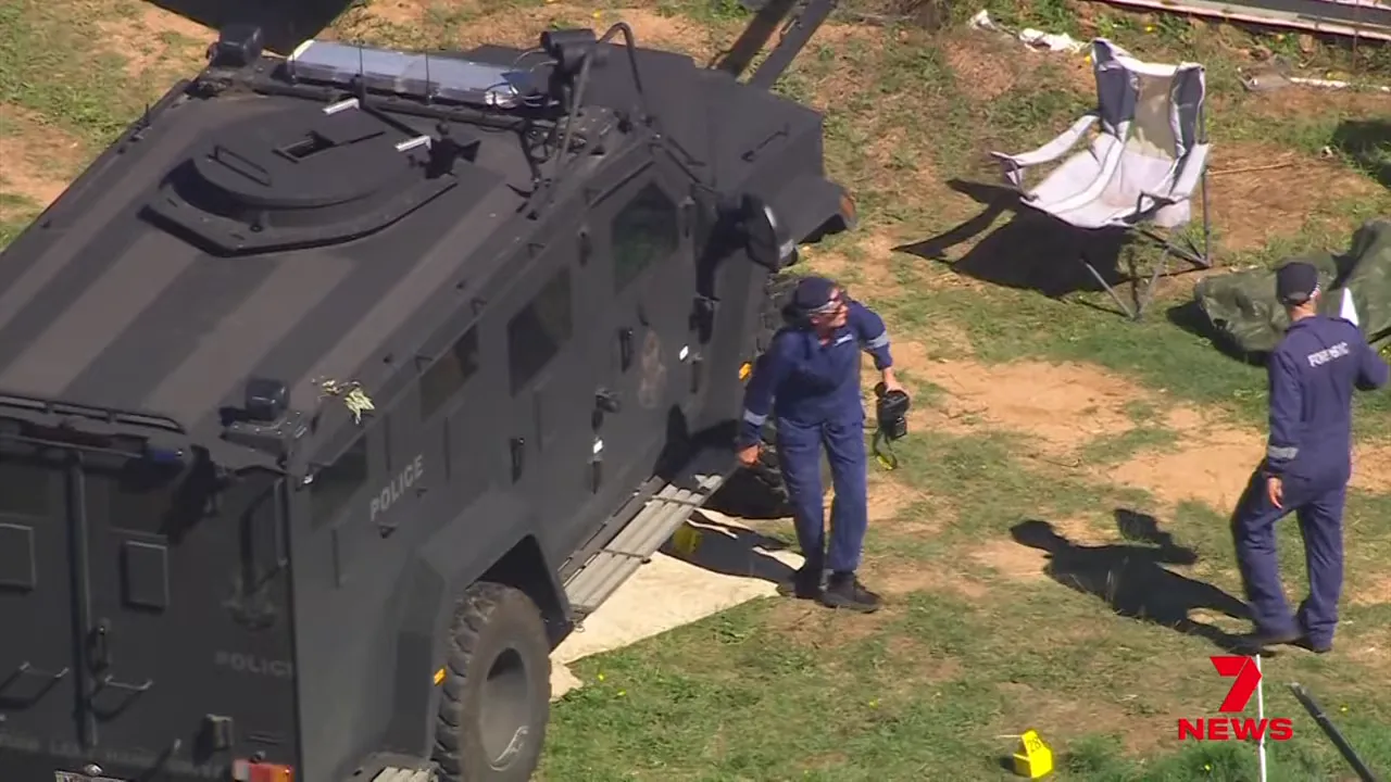 Overhead view of police vehicle and officers at the Desi Freeman investigation location