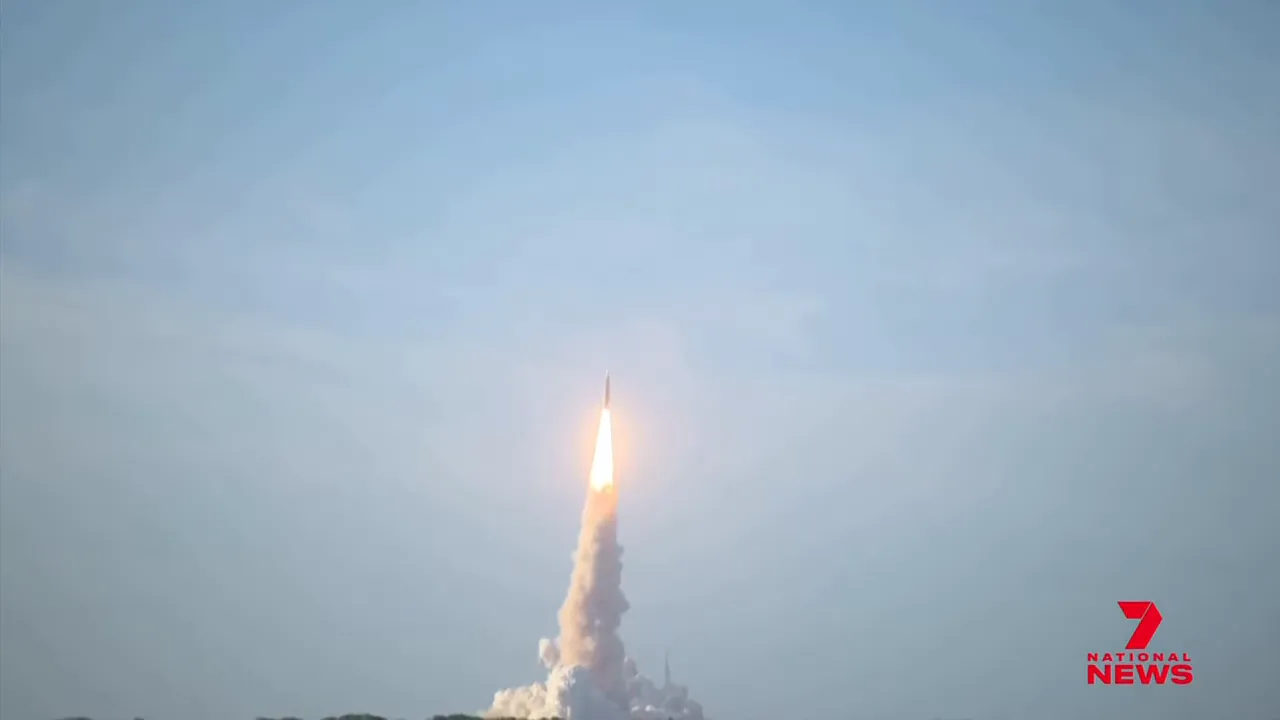 Artemis 2 rocket ascent shortly after liftoff with bright engines and exhaust trail