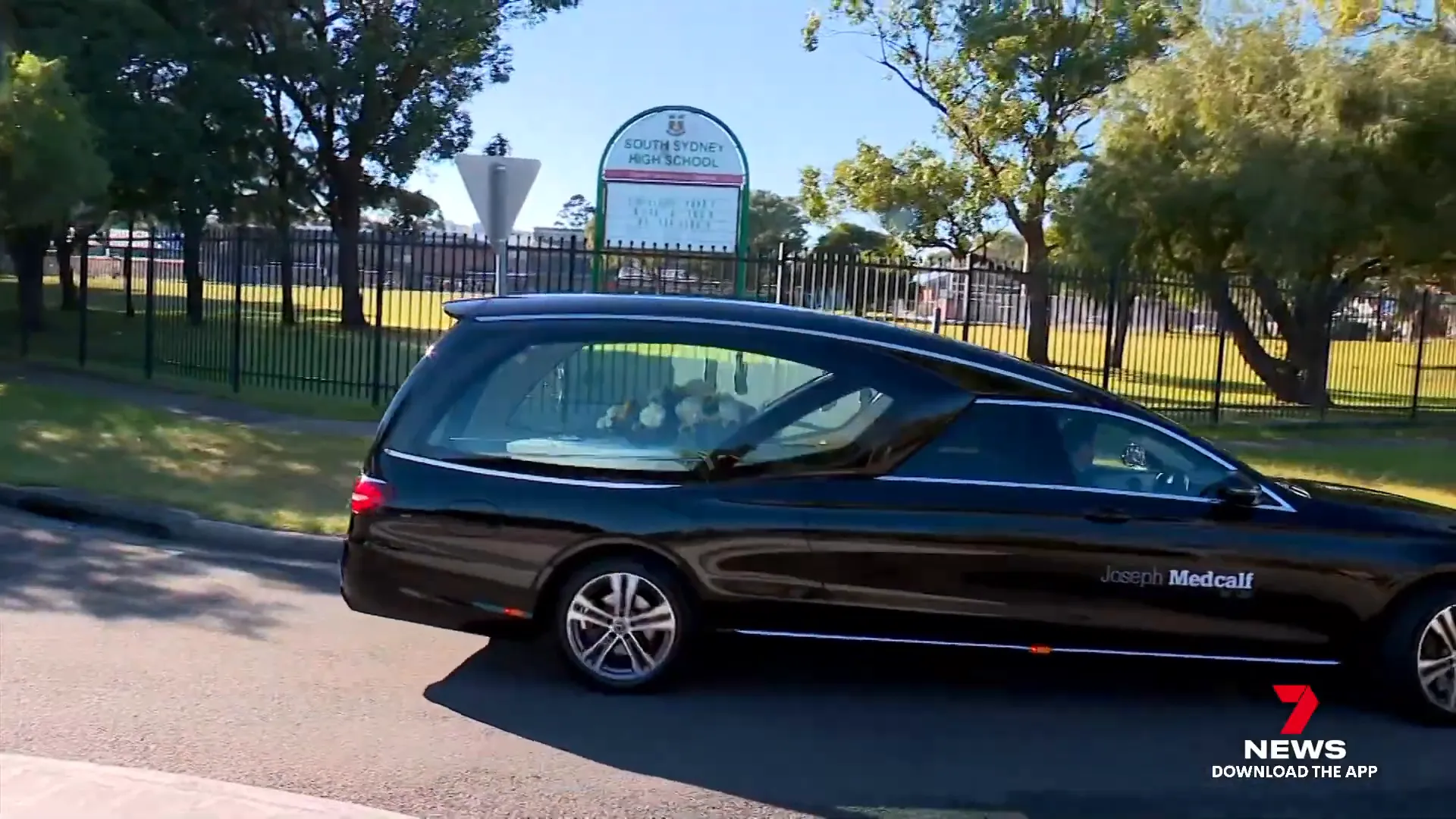 Funeral procession passing South Sydney High School