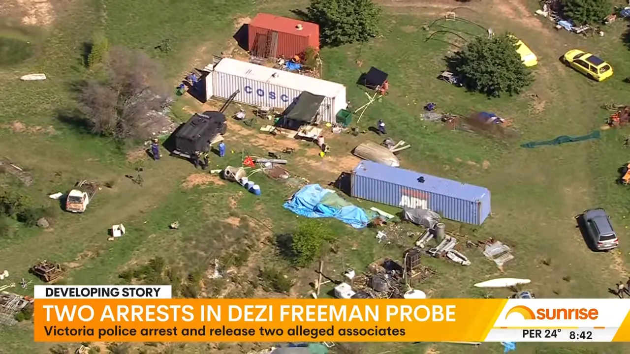 Aerial view of police investigation site at Dezi Freeman probe with officers and vehicles