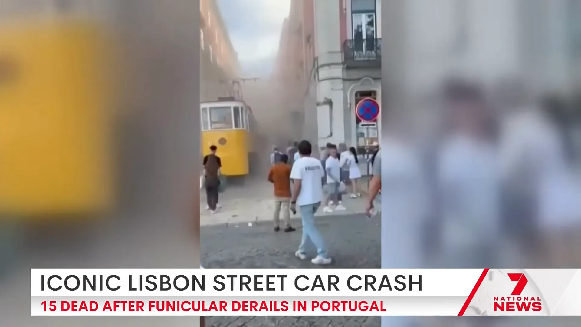 A yellow funicular tram on a steep Lisbon street