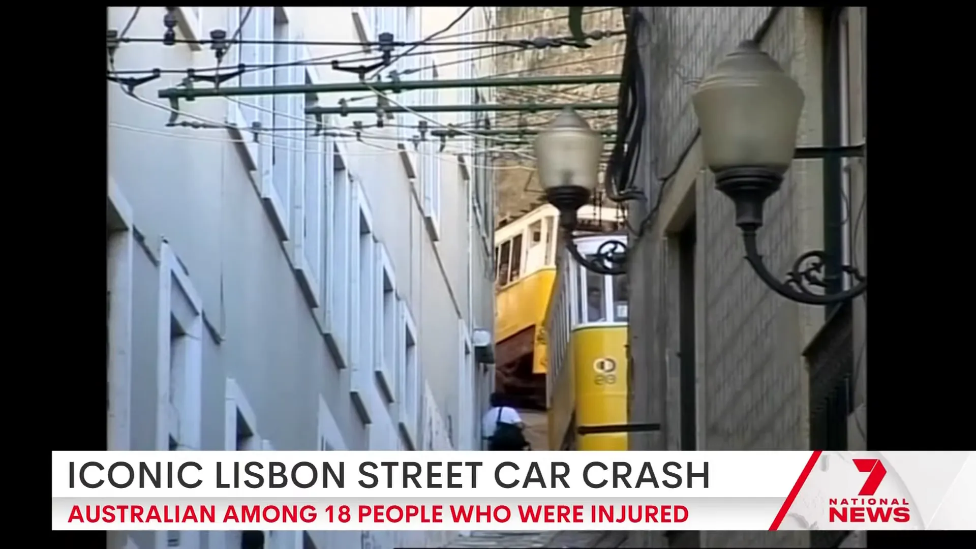 Historic funicular cars travelling up a steep Lisbon incline