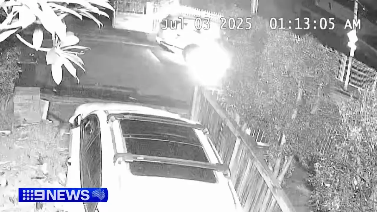 Burning getaway car rolling down the street