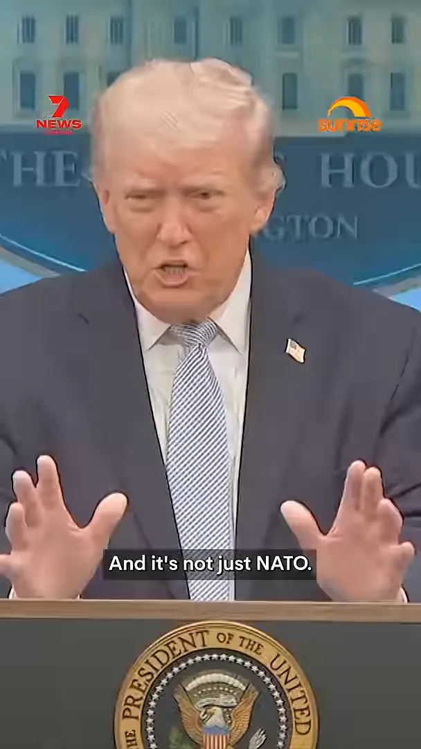 Donald Trump speaking at a podium with caption text 'And it's not just NATO' about Iran ultimatum allies