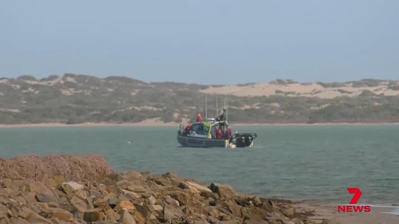Surf rescue boat operating offshore near the Goura mouth during search and rescue operations.