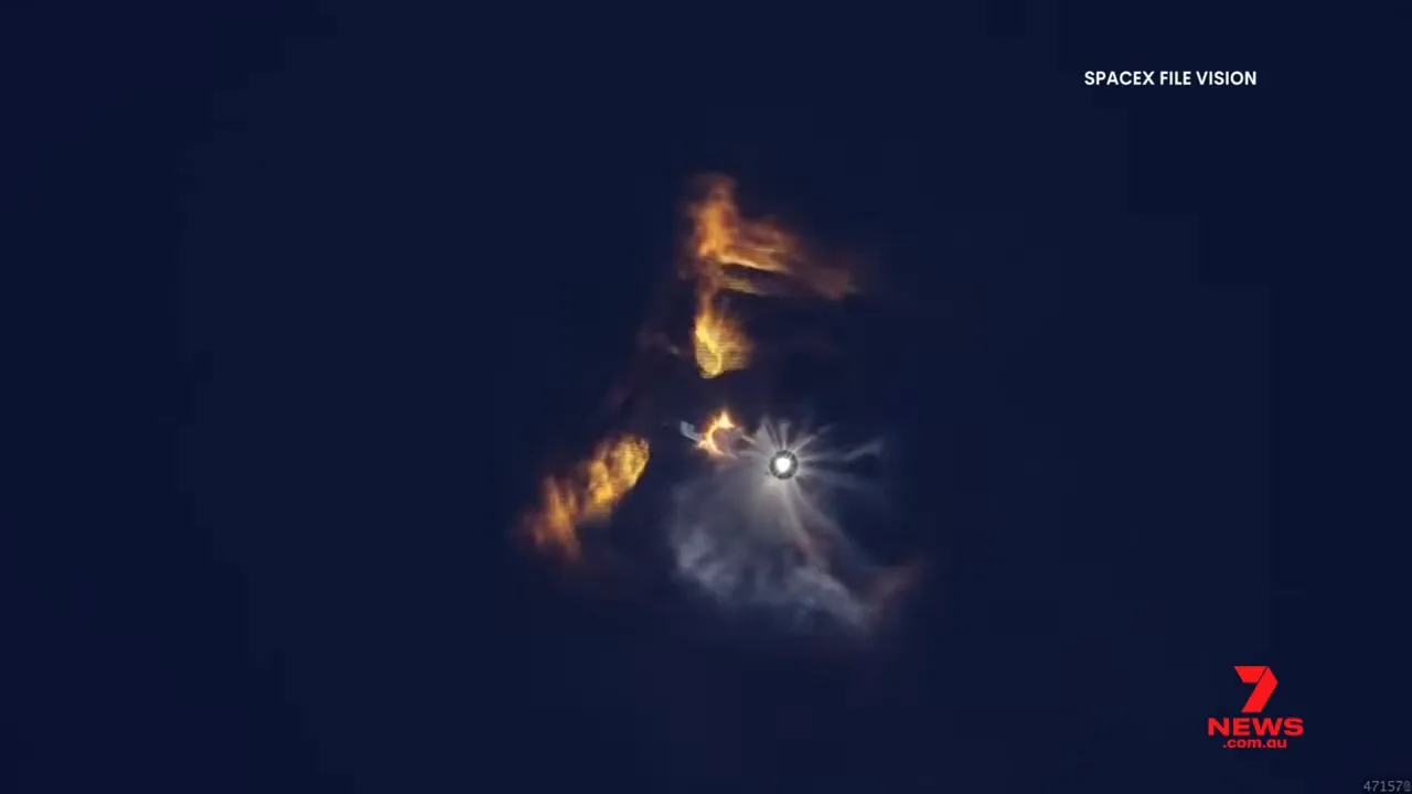 Rocket stage with fiery plume and exhaust against a dark sky labeled 'SPACEX FILE VISION'