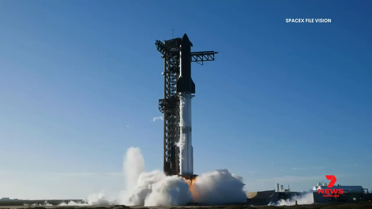SpaceX rocket lifting off from a coastal launch pad with plume and vapor around the base