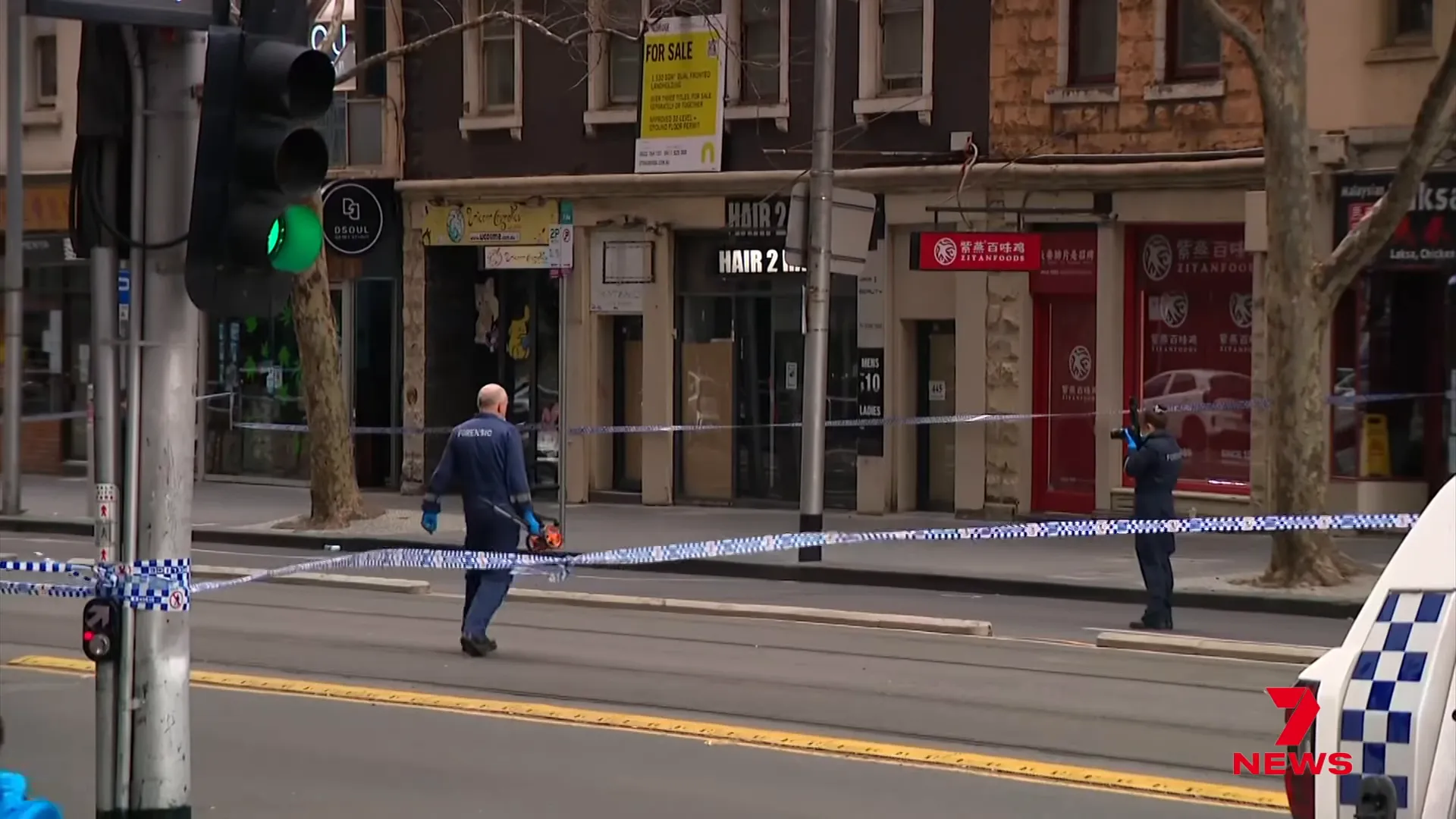 Street outside 450 Elizabeth Street with forensic markers