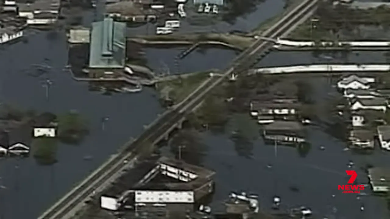 Aerial shot of flooded neighbourhoods, submerged roads and bridges after a cyclone
