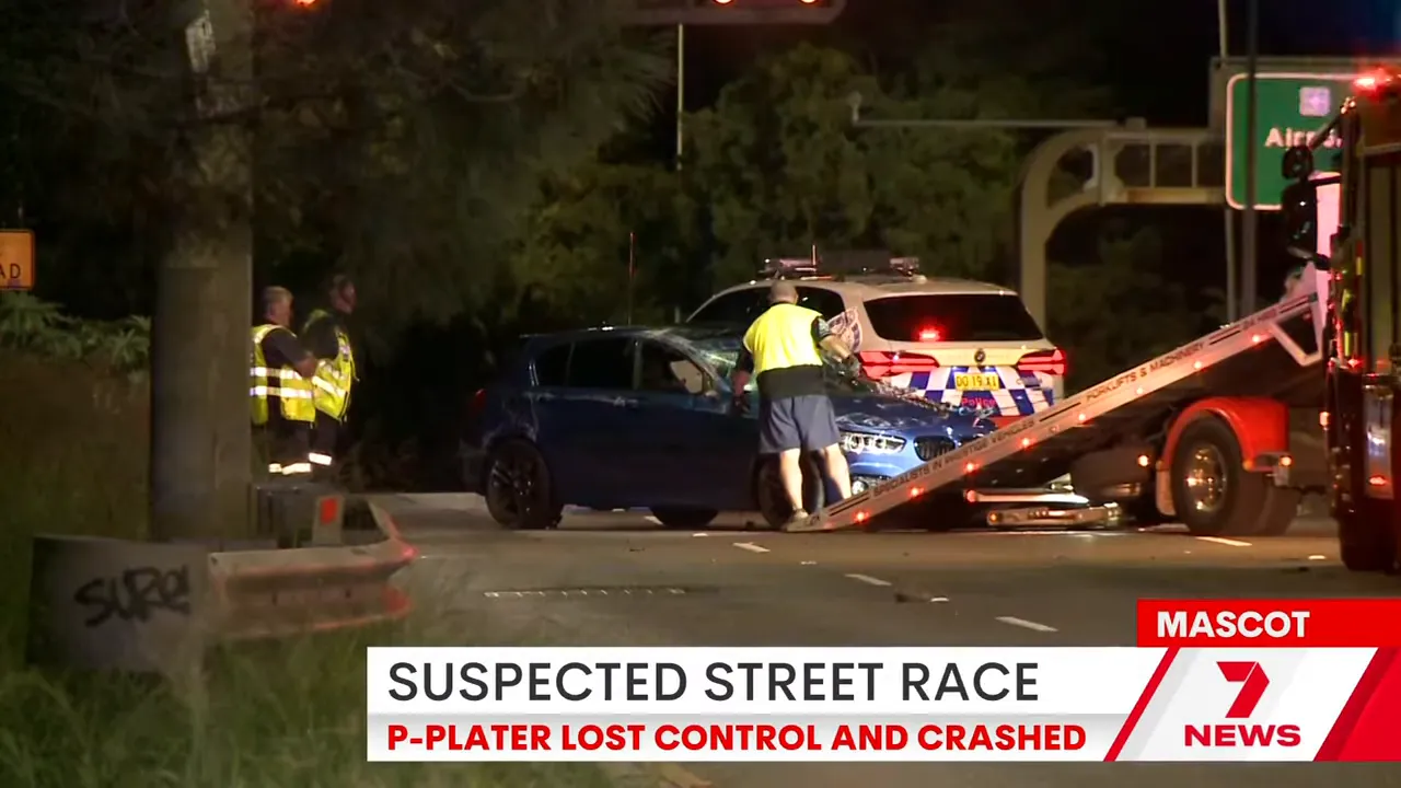 Police and emergency responders at a damaged car crash site on General Holmes Drive near Sydney Airport